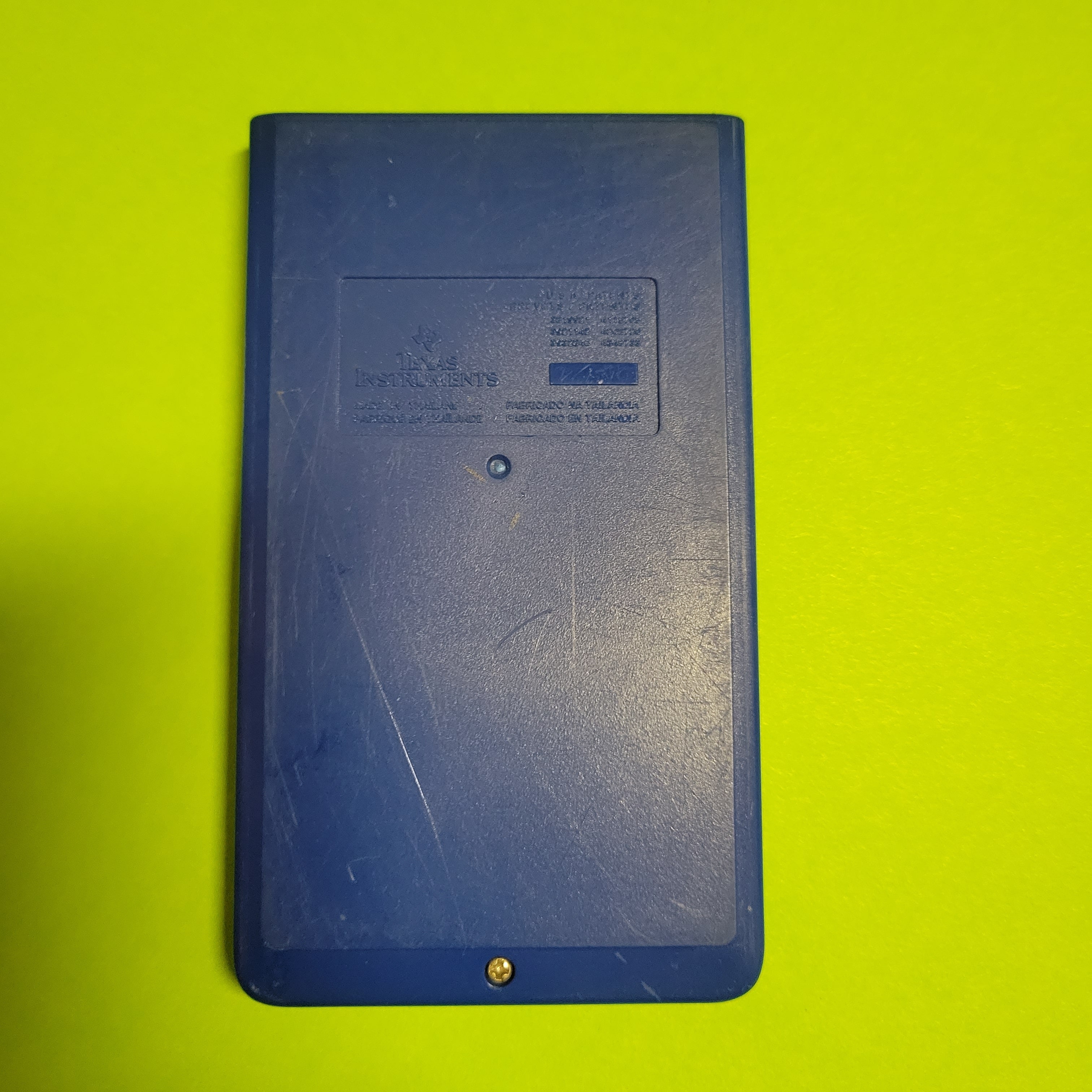 An image of the back of a ti-108 four function plus calculator